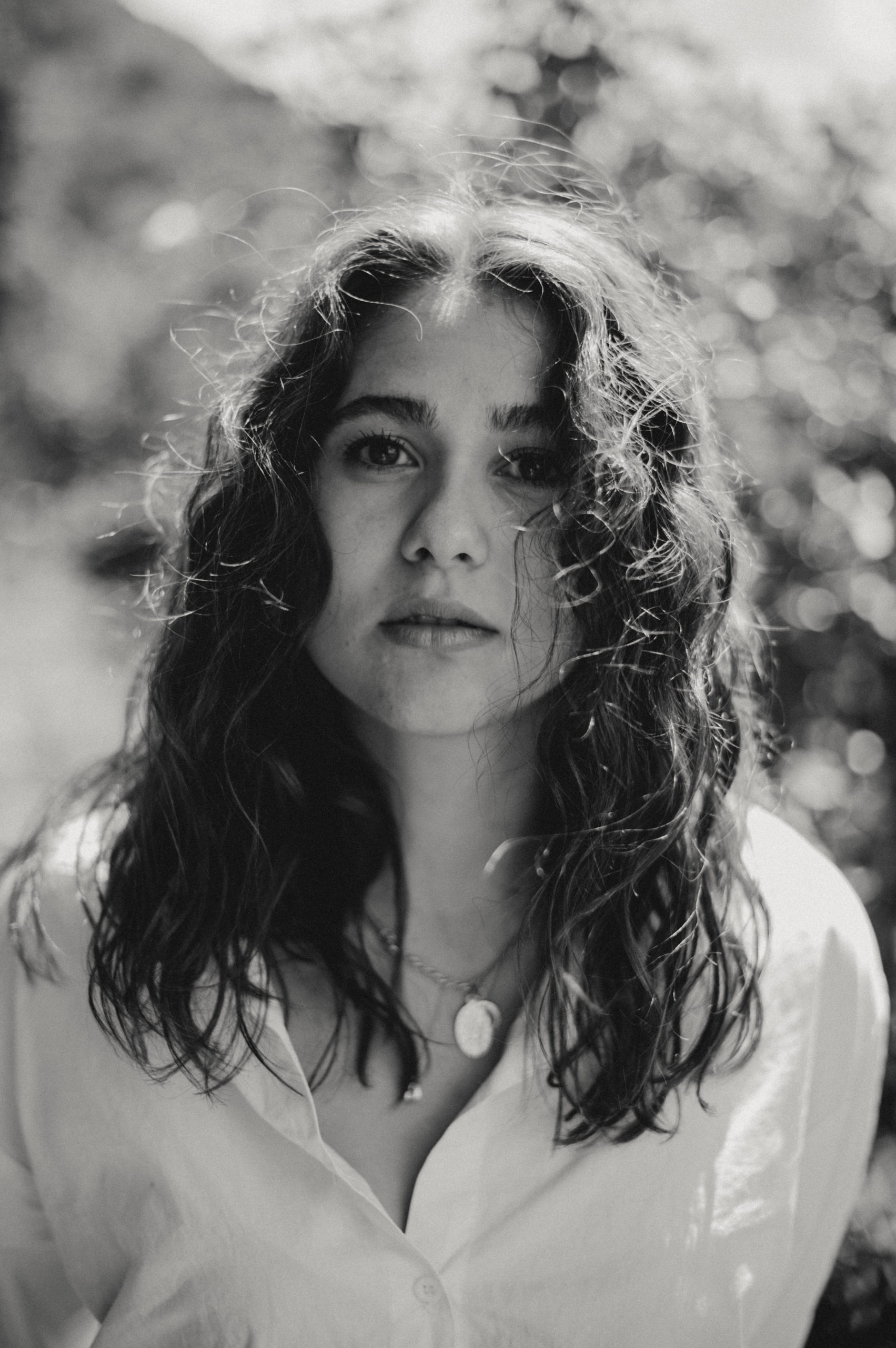 Black and white portrait of woman with curly hair